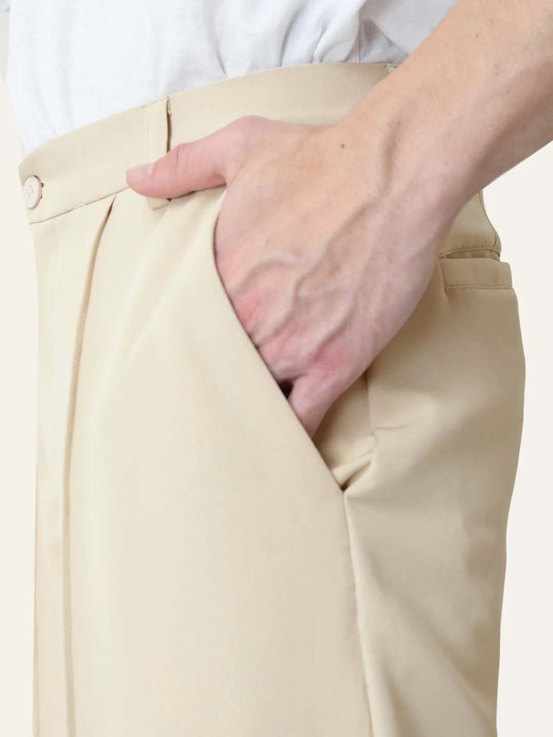 Men Pleated Trousers in relaxed fit beige fabric, showcasing side pocket detail for a stylish Korean pants look.